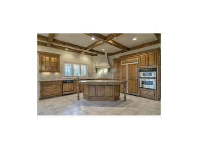 Kitchen w corner cooktop, center island, and panel
