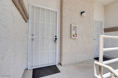 Entrance to property with stucco siding