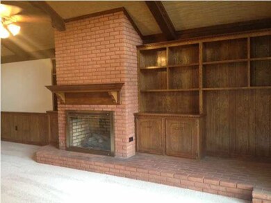And brick fireplace and more built-ins