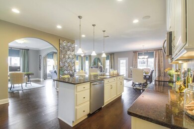 People love the wide open feel of this Great Room, Dining space, Flex Room & Kitchen.