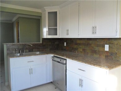 Kitchen Stainless steel appliances with stone back