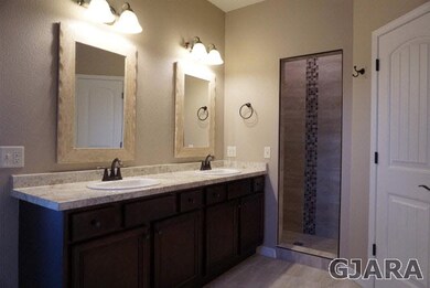 The Master Bath offers double Vanities, Custom Wal