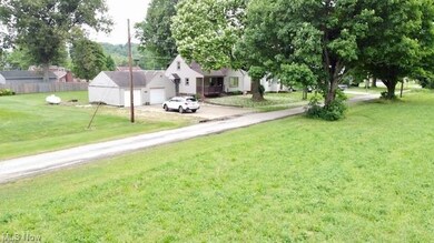 Across the street is a large field owned by a neighboring farmer.