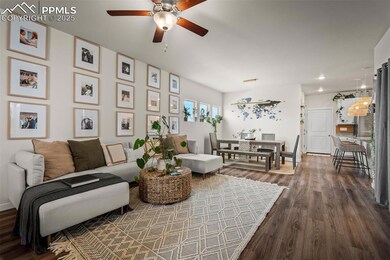 Living room with a ceiling fan, dark wood-style fl