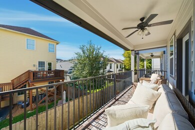 A long balcony spans the back of the house with an entrance off the primary bedroom.