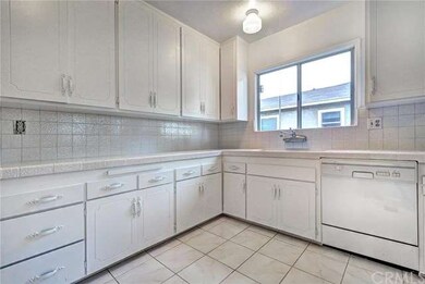 Bright kitchen with lots of cupboards.
