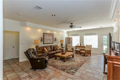 This living area is literally the heart of this home, situated in the middle of the remainder of the rooms downstairs.  The windows across the back wall overlook the backyard. The windows throughout home are insulated windows for energy efficiency.