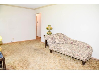Living room with crown molding.