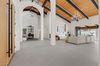 Living room with a wooden ceiling with exposed bea