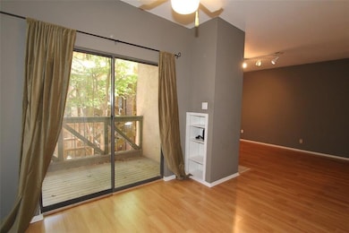 Spare room featuring wood finished floors, a ceil