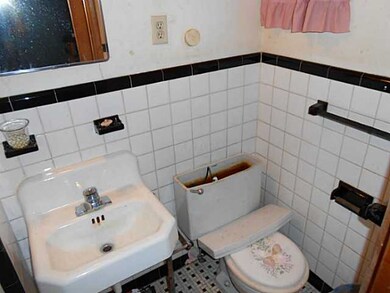 MBR bath with tile flooring..