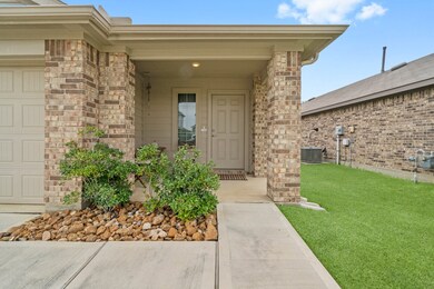This inviting covered front porch offers visitors a retreat from summer sun and rain.