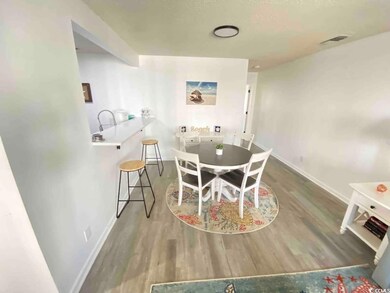 Dining area featuring wood-type flooring