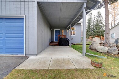 Covered porch way w/concrete sidewalk.