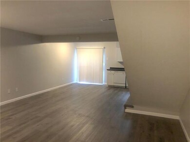 Each of the four units showcases a living room.