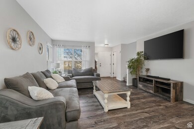 Living room featuring dark hardwood / wood-style flooring