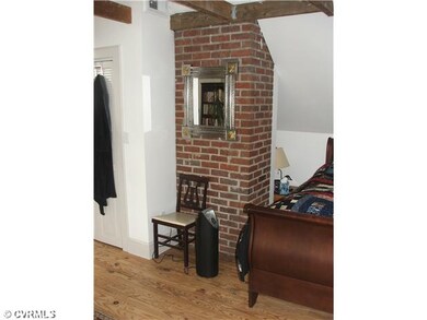 Master Bedroom - Exposed Brick in master suite.