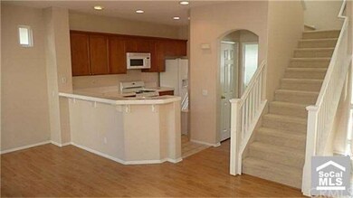 Open floor plan with wood floors and soft tone new