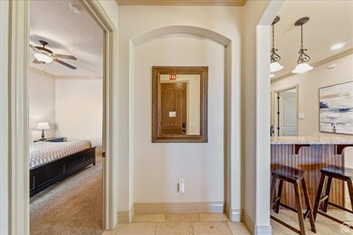 Hall featuring baseboards and ornamental molding