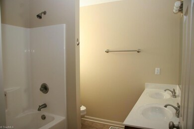 Master bath features a double bowl vanity and brushed nickel hardware.