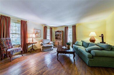 Formal living room has beautiful hardwood floors -