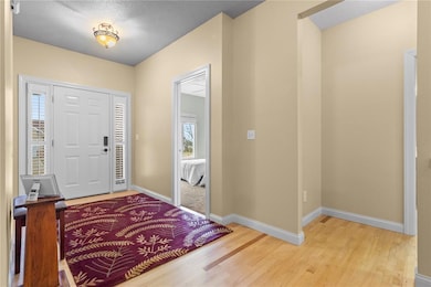 foyer with maple flooring
