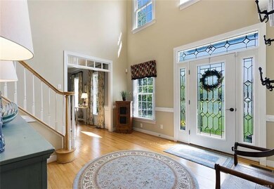 View of Front Door with Transom above and side lig