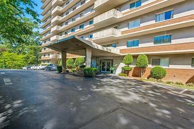 View of property with uncovered parking