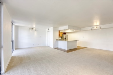 Unfurnished living room with light colored carpet