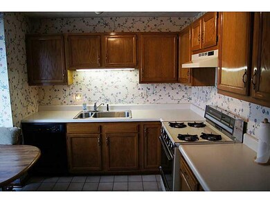 Kitchen. The Eat-In Kitchen Features Oak Cabinetry
