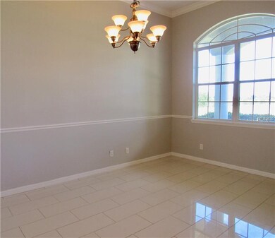 Dining Room with Tray Ceilings, Crown Molding and 
