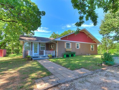 Side of home with deck and rear entrance.