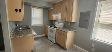 Kitchen with a wealth of natural light, tile floor