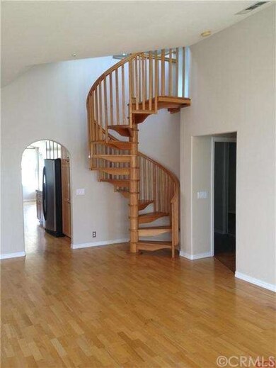 Staircase in living room that leads to bedroom or 
