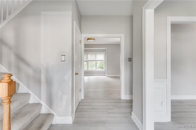 Foyer entrance with stairwell to second floor, hal