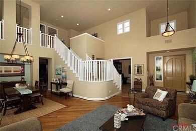 Luxurious hardwood floors welcome you home. Impres