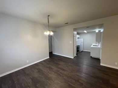 Unfurnished dining area with baseboards, a notabl