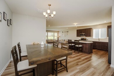 Spacious, open floor plan with luxury vinyl plank flooring through entry, kitchen and dining areas.