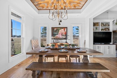 Dining room with beautiful wood design on ceiling and table w/ chairs negotiable