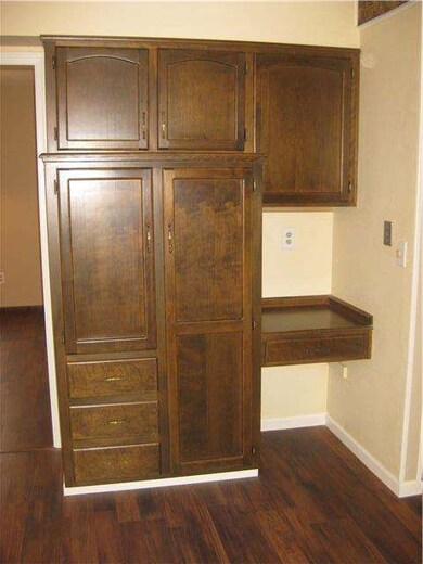 Kitchen features pantry and desk top.