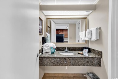 Bathroom featuring tile patterned flooring and sin