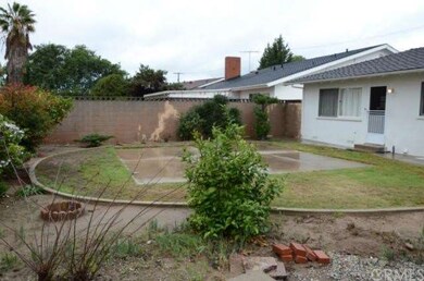 Large rear yard with 2 fruit trees.