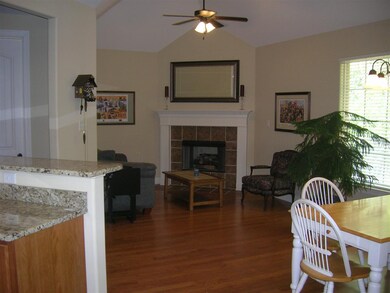 Brick fireplace with Gas Logs     Eating area to t