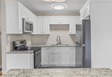 Kitchen with granite counters and stainless appliances