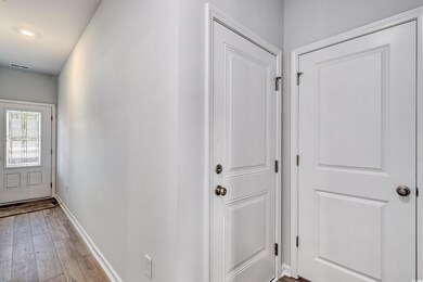 Interior space featuring baseboards, visible vents
