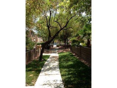 Property Photo. Walkway outside the front patio ga