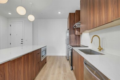Kitchen with modern cabinets, wall chimney range 