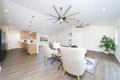 Living, dining, and kitchen.