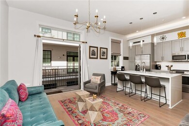 Living room looking out to balcony w/doors open