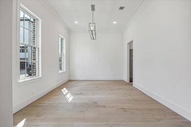 Dining room with chandelier is located at the fron